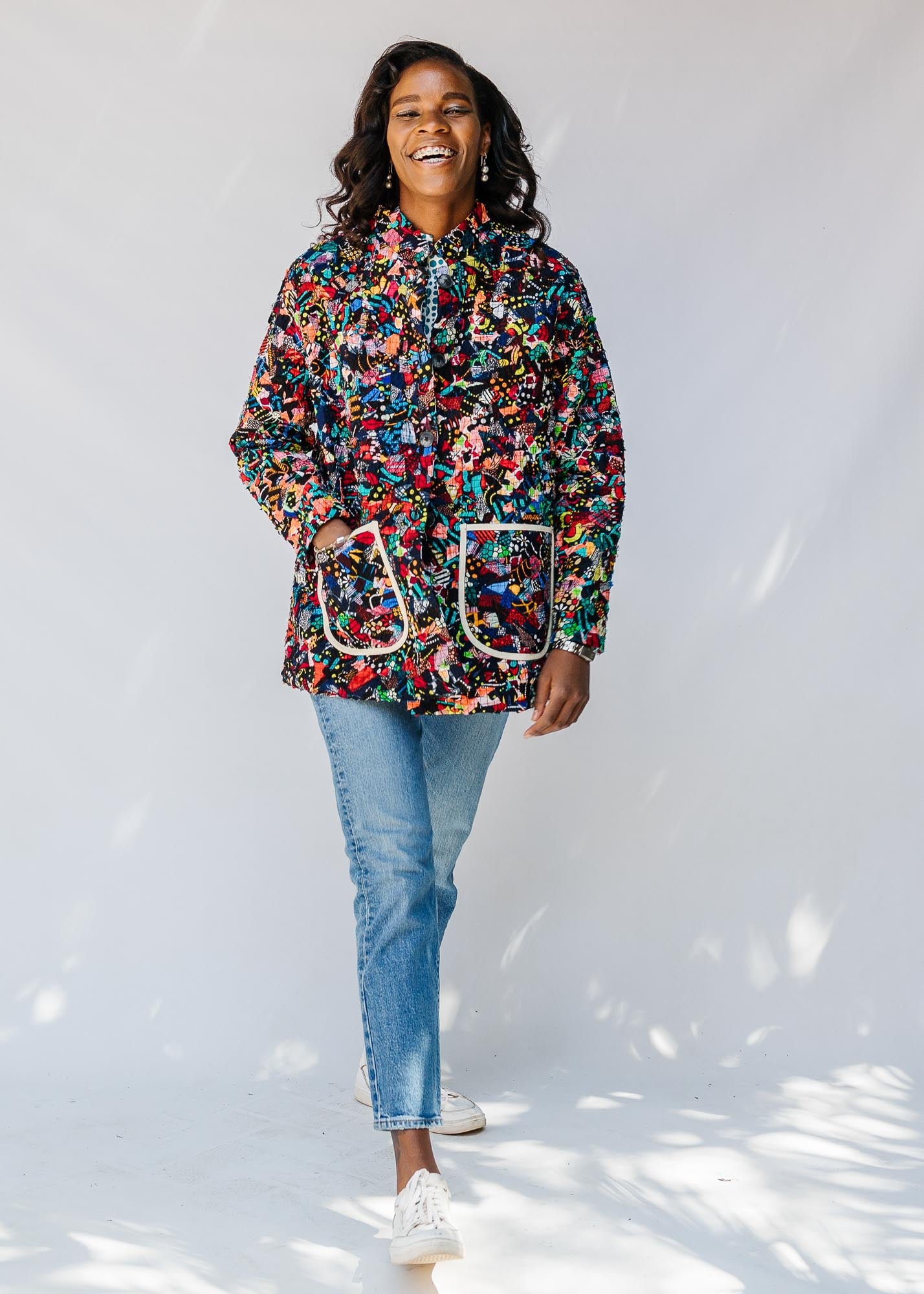 Model wearing quilted multicolor jacket