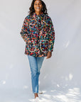 Model wearing quilted multicolor jacket