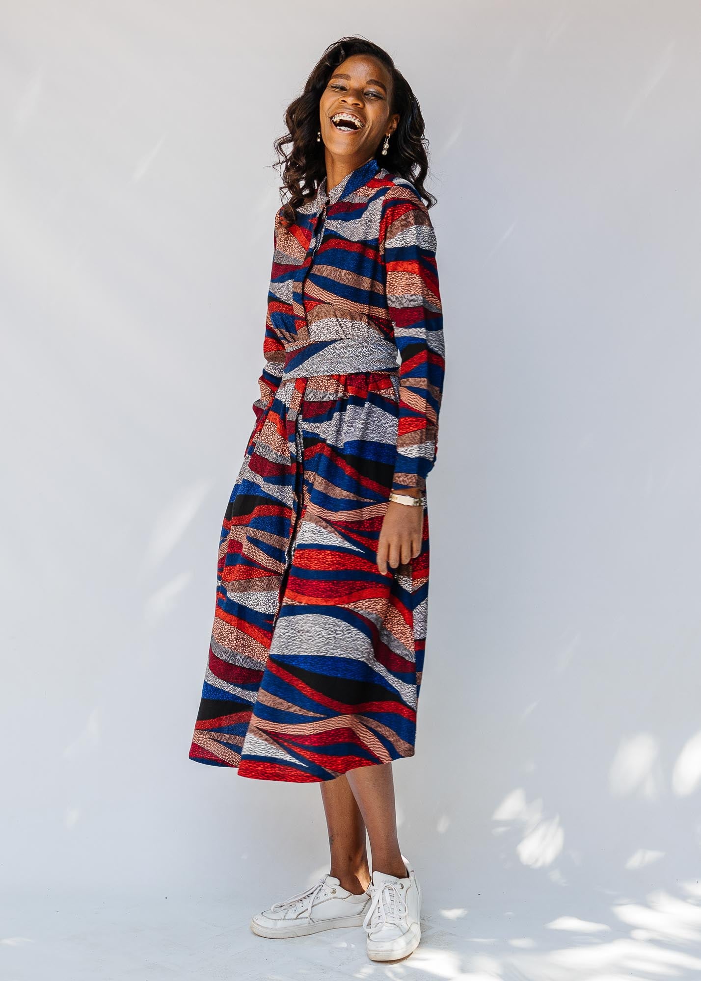 model wearing midi - length belted print dress