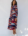 model wearing midi - length belted print dress