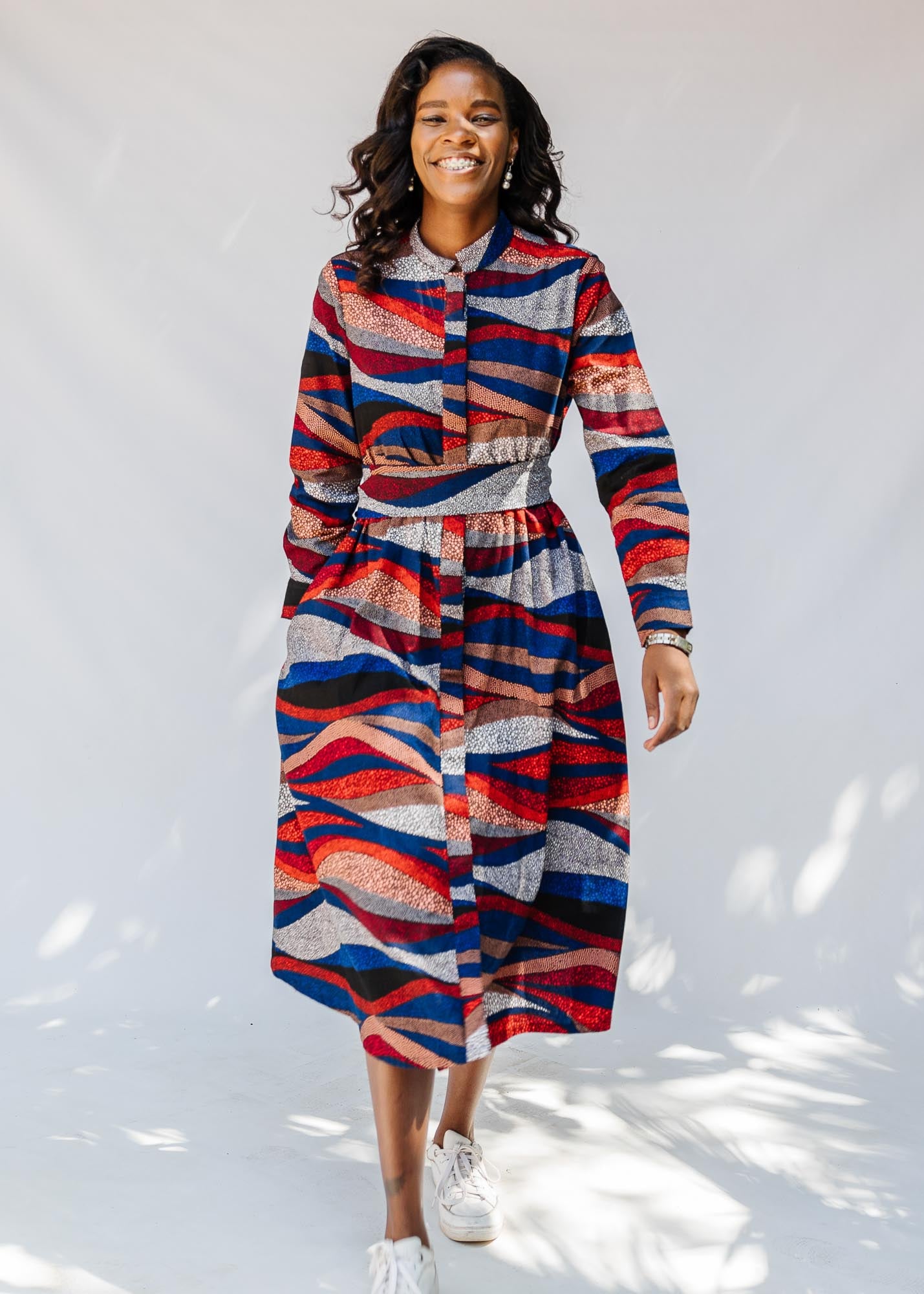 model wearing midi - length belted print dress