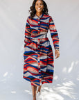 model wearing midi - length belted print dress