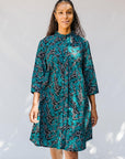 model wearing teal printed dress 