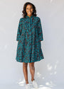 model wearing teal printed shirt dress