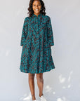 model wearing teal printed shirt dress