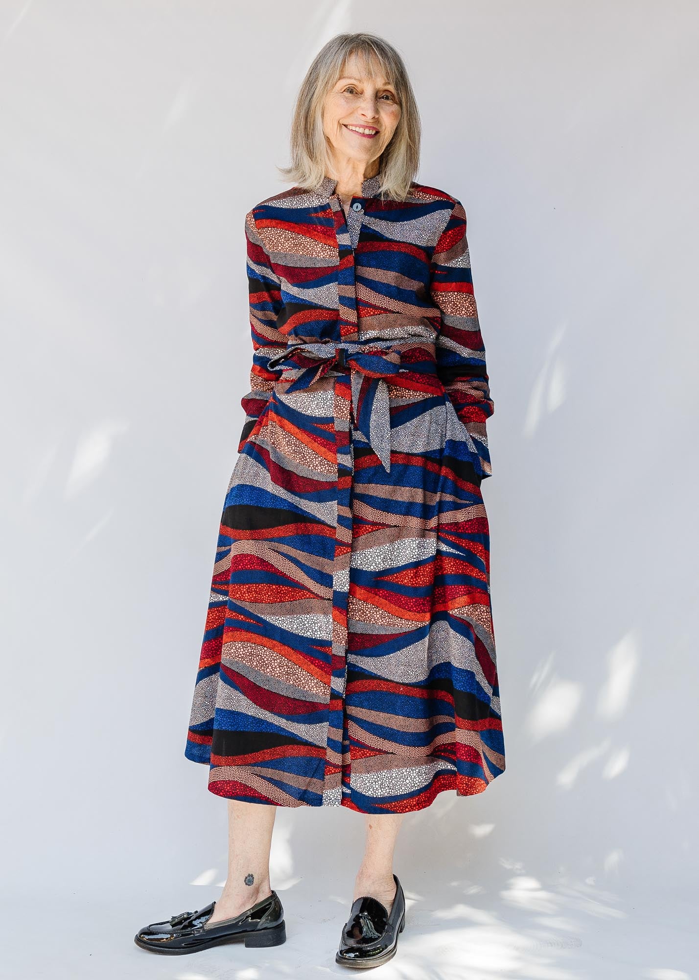 model wearing midi - length belted print dress