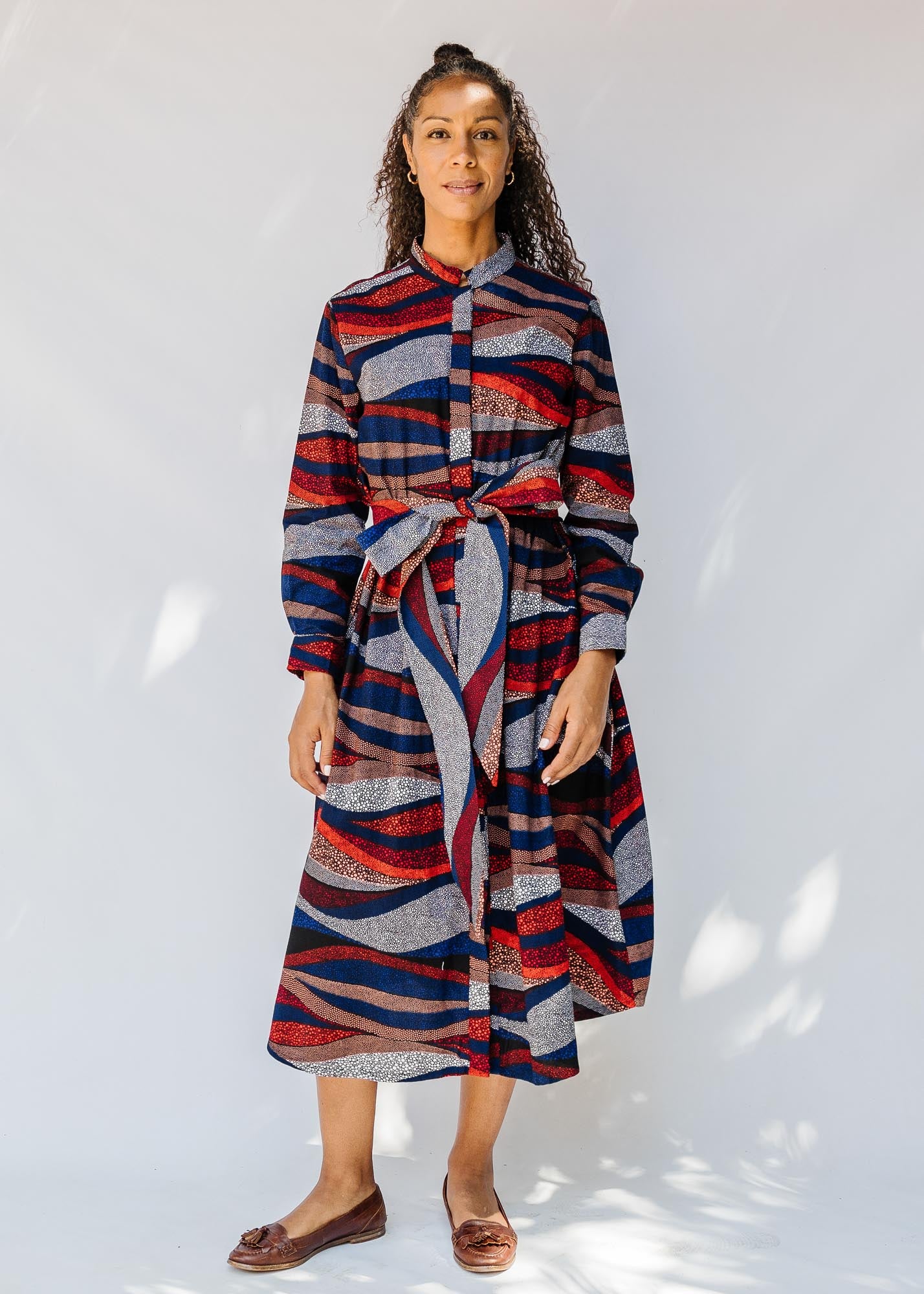 model wearing midi - length belted print dress