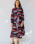 model wearing midi - length belted print dress