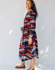 model wearing midi - length belted print dress