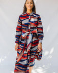 model wearing midi - length belted print dress