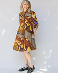 model wearing earth tone abstract design dress