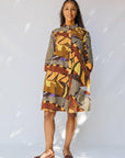 model wearing earth tone abstract design dress