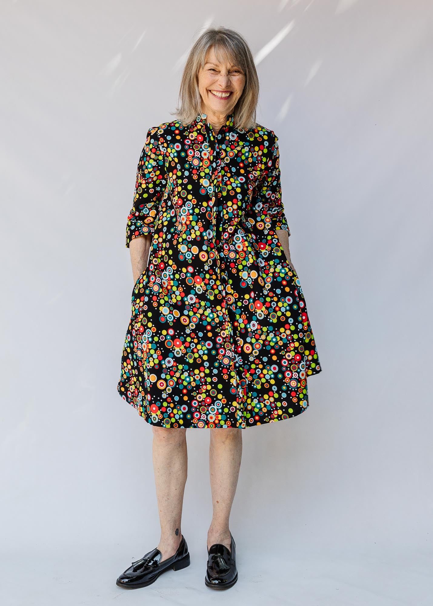 model wearing a multicolor print dress