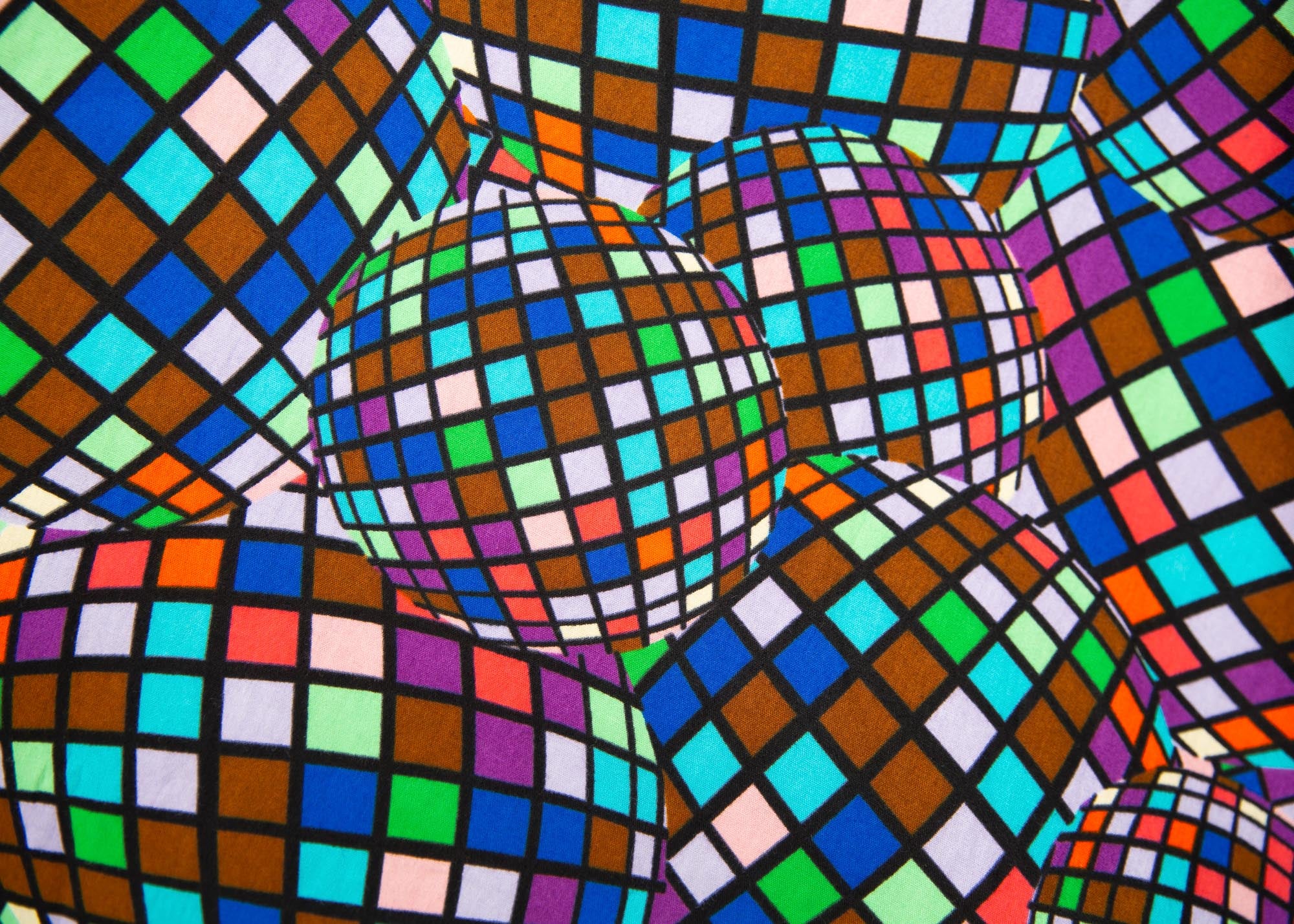 Close up display of multi colored dress with disco ball print