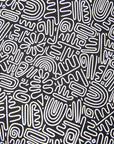 Close up display of black and white doodle print dress