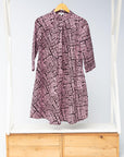 Display of brown and baby pink abstract print dress