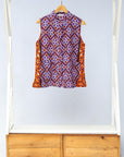 Display of orange, purple, white and black mixed pattern kanga tank