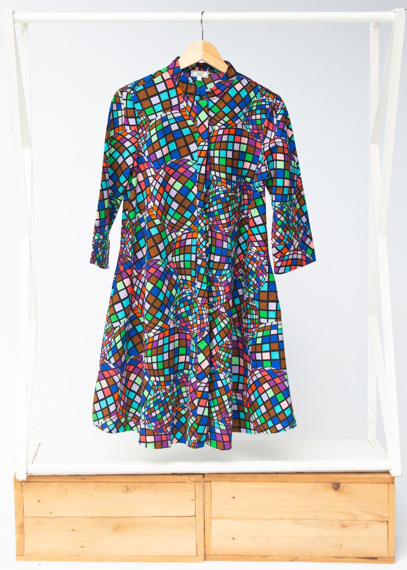 Display of multi colored dress with disco ball print