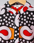 Display of red, white, black and orange mixed pattern long sleeved kanga shirt