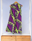 Display of yellow-green dress with purple, black, white fish print 