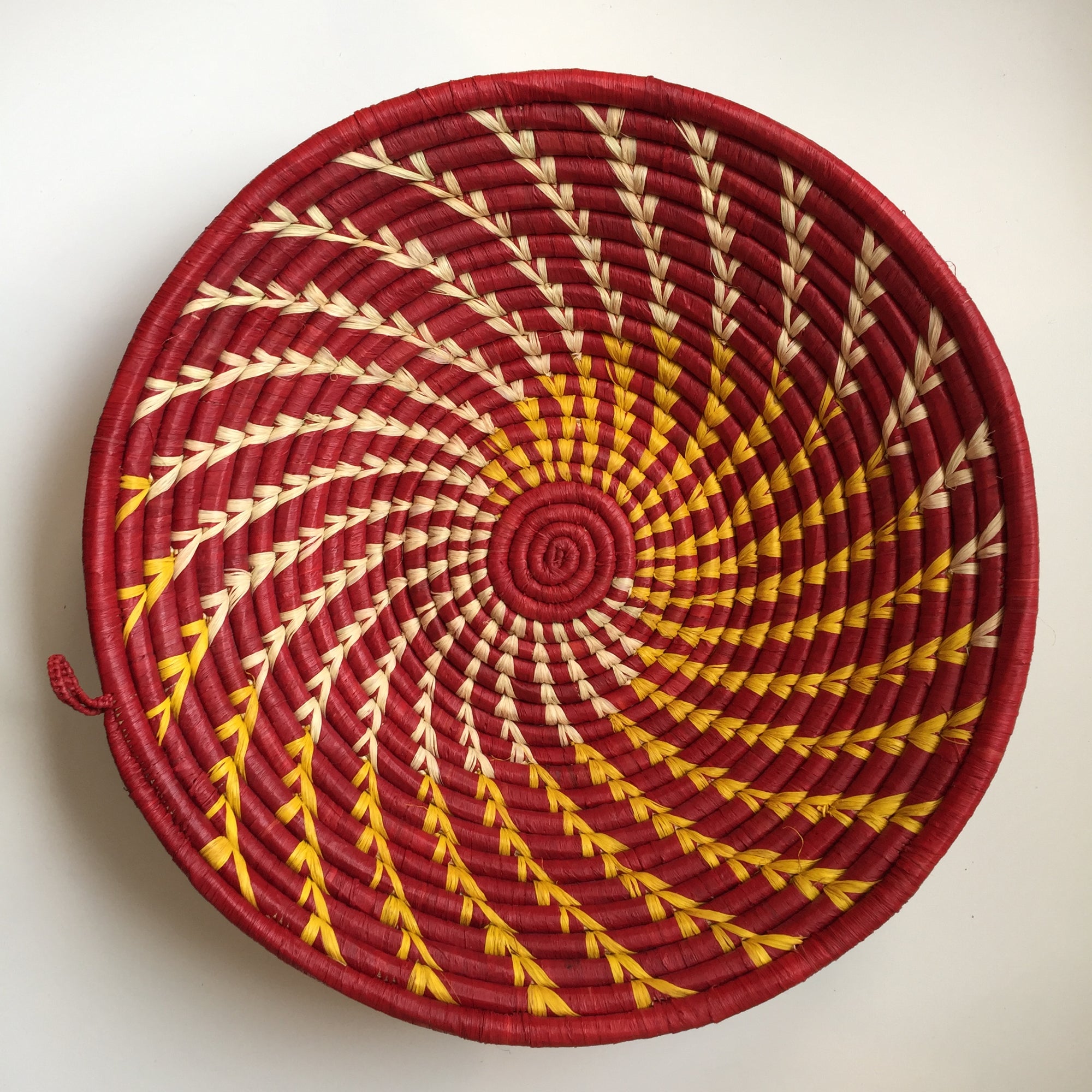 Red and yellow swirl woven bowl