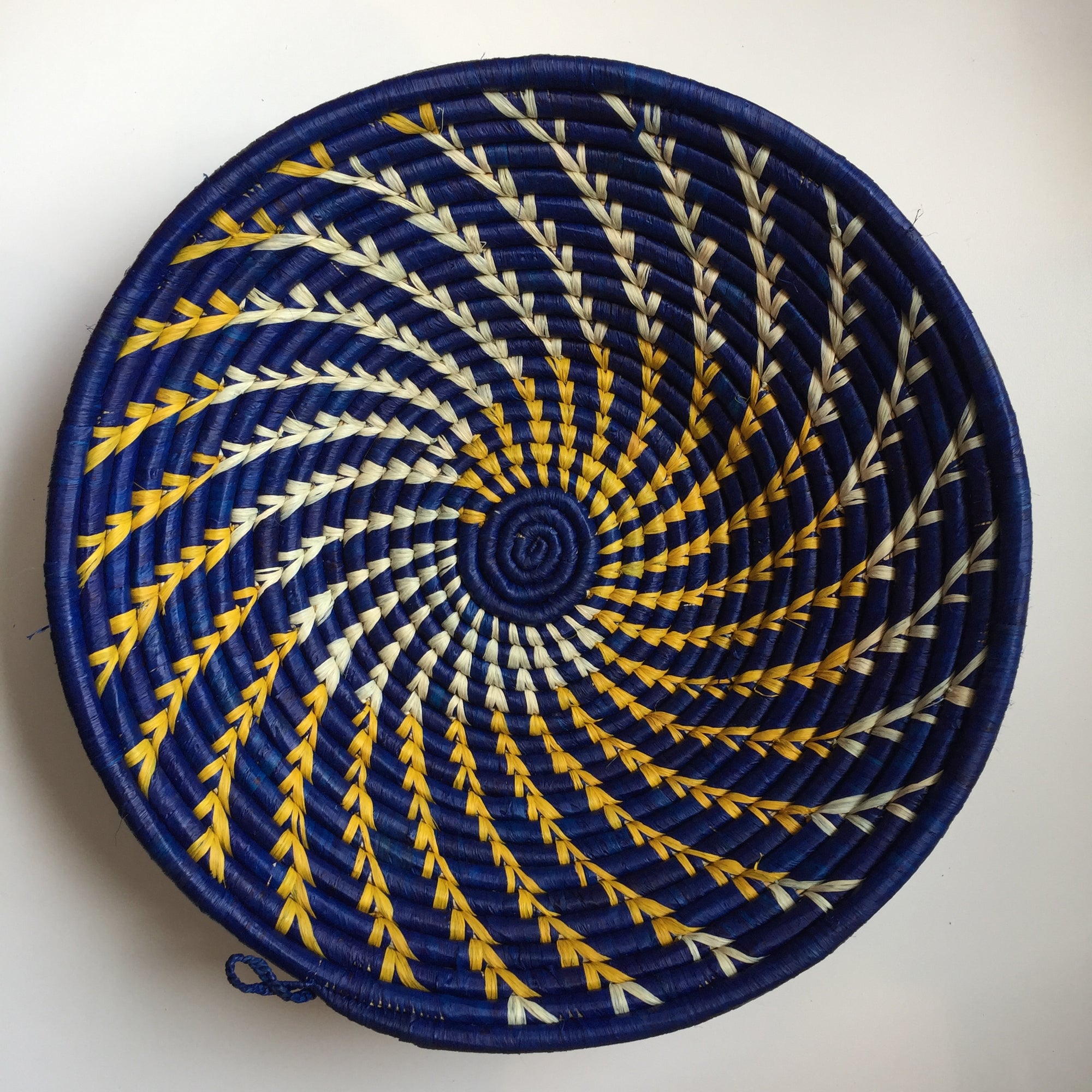 Blue and yellow swirl woven bowl